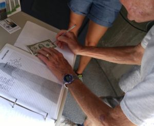 Bob Signing the 2 dollar bill for the fifth year in a row after his climb at 90